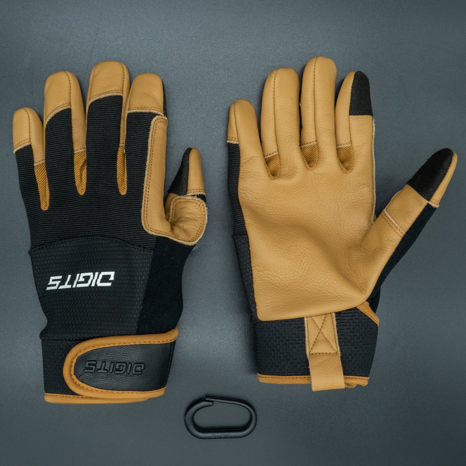 A pair of work gloves laid out flat, featuring a combination of black and brown colors with leather on the top and a canvas material on the back of the glove. The brand 'Digits' is visible on the Velcro strap.